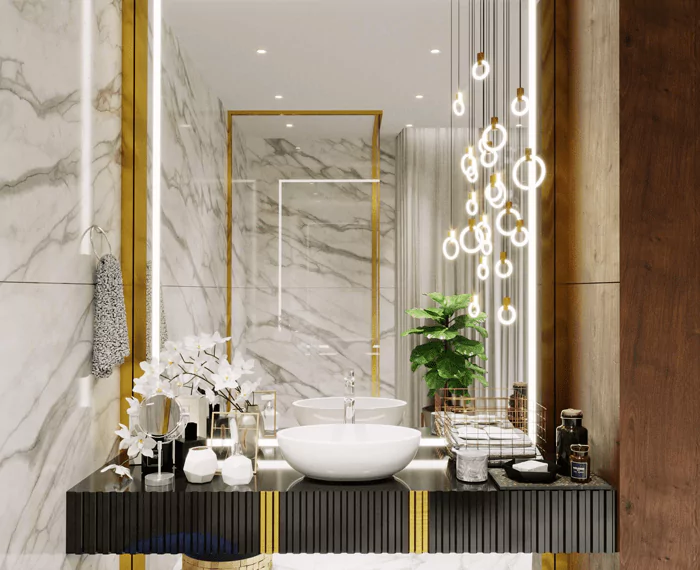 Marble tiled wall with custom-tailored LED mirror and white washbowl in a restroom.