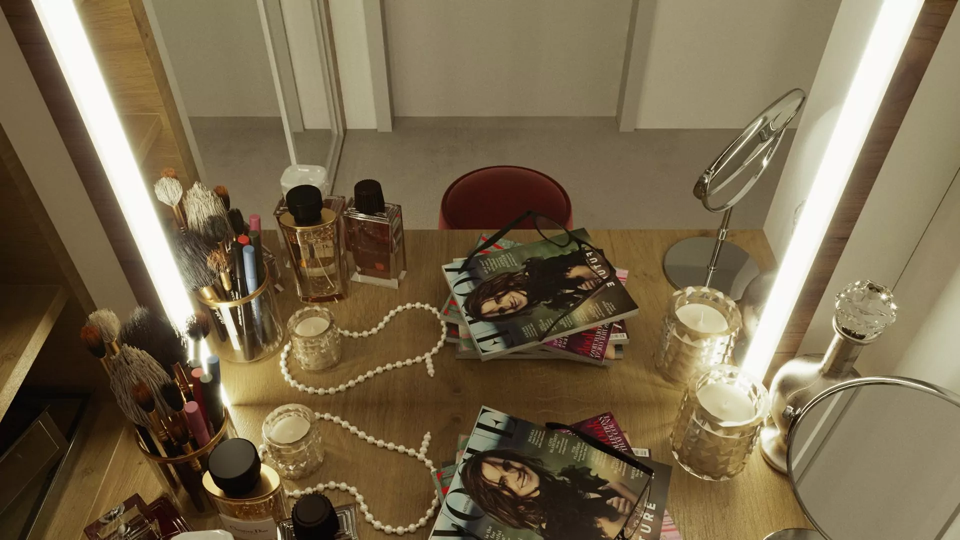 A table with books and makeup reflected in a lit mirror.