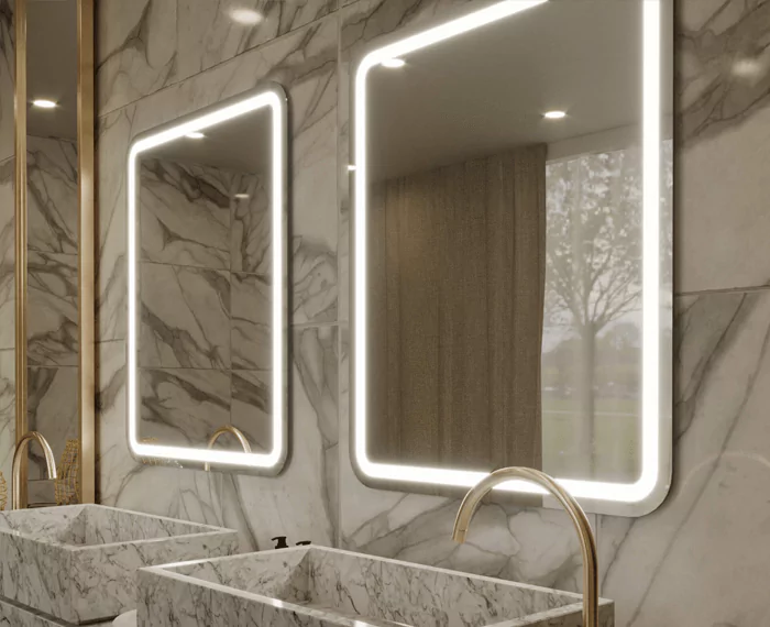 Lavatory with two custom-made lighted mirror installed in a brown porcelain wall.