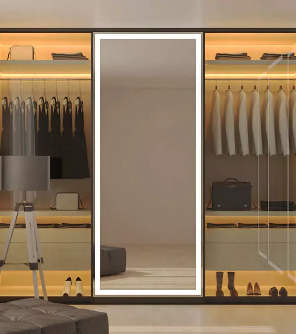 A preview of a full-length lit mirror placed at the center of an elegant walk-in closet.